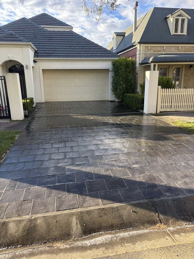 Charcoal brick driveway at premium Adelaide home — May Paving