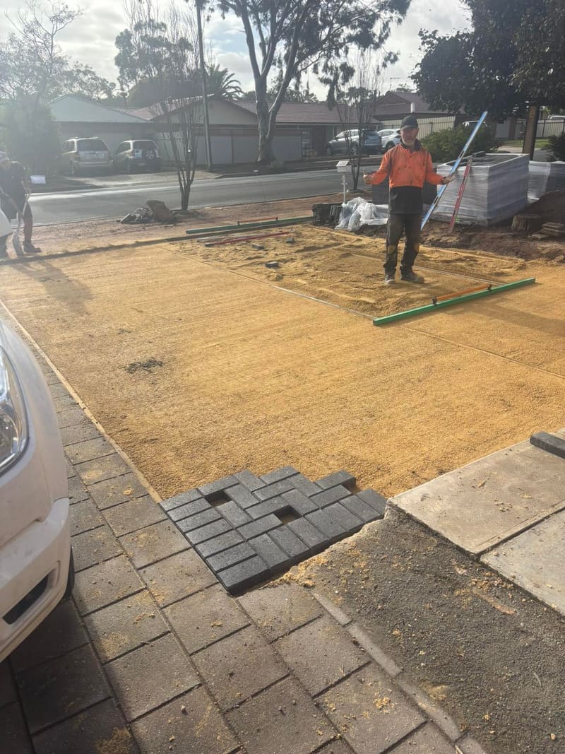 May Paving crew laying a charcoal brick driveway in Gawler SA